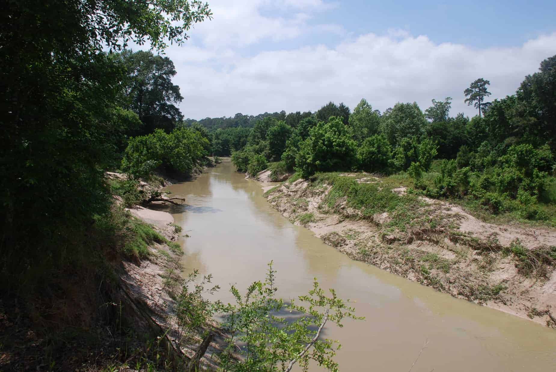 View of Cypress Creek from Northern Edge of 100 Acre Wood Preserve Houston TX along dirt hiking trail