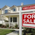 Real estate For Sale sign at a Houston foreclosure or bank-owned home