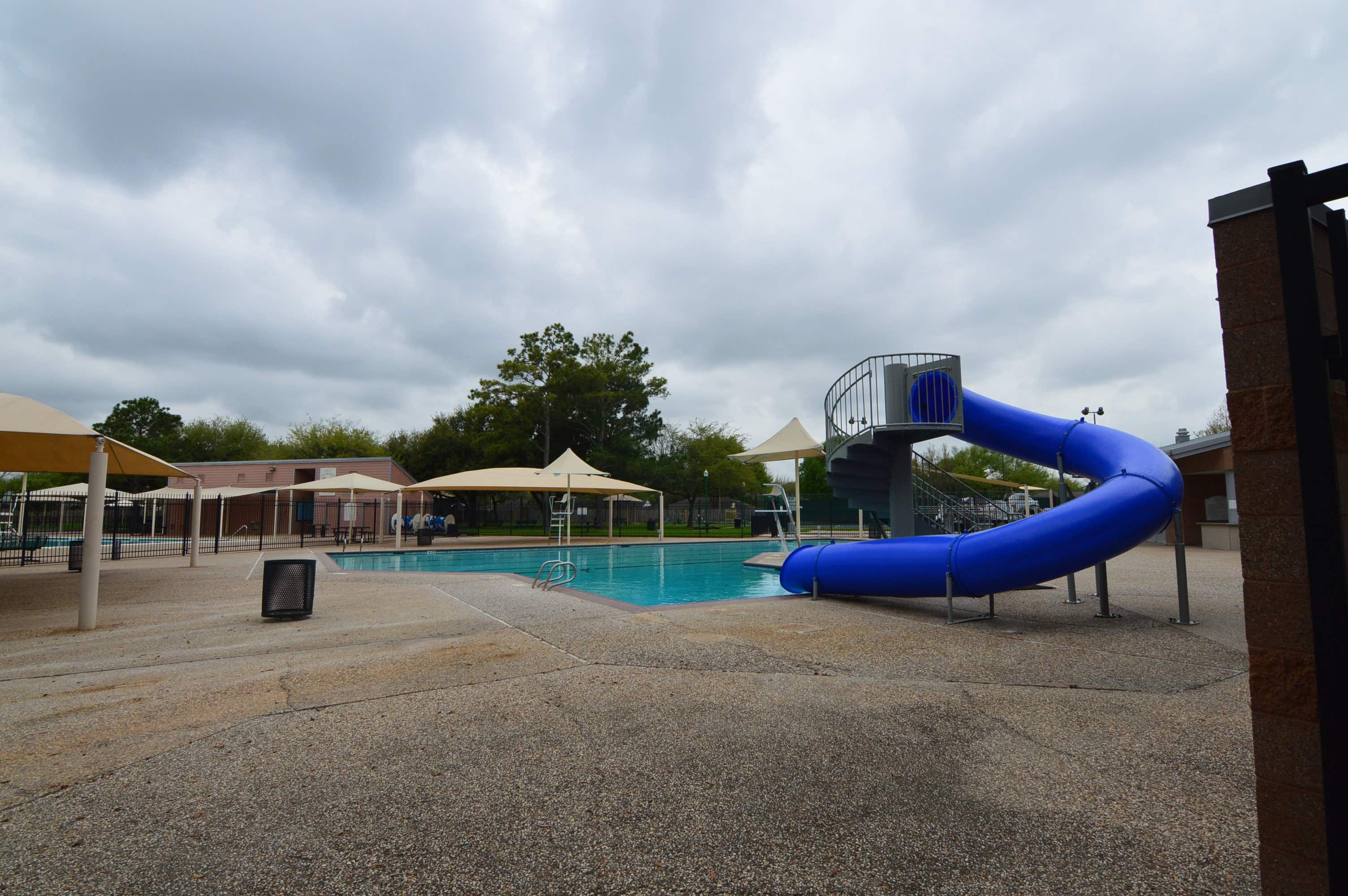 Blue water slide at the Concord Bridge community pool, Houston TX