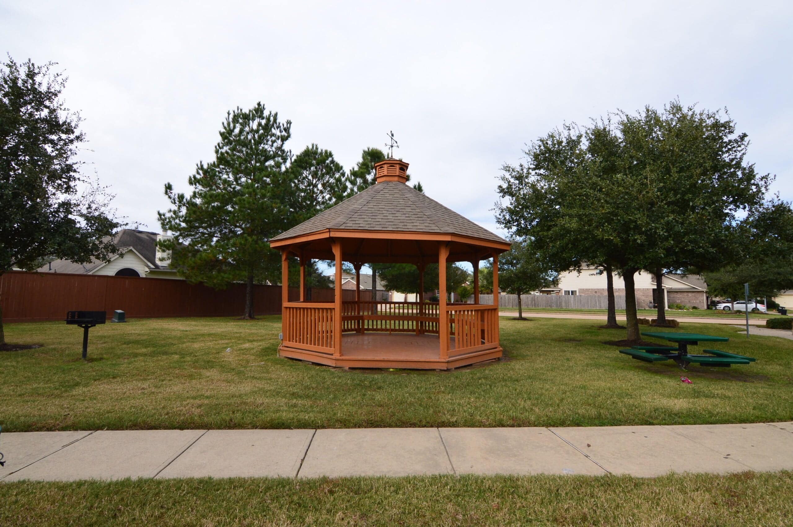 Gazebo and picnic tables in a Westgate park area, Cypress TX
