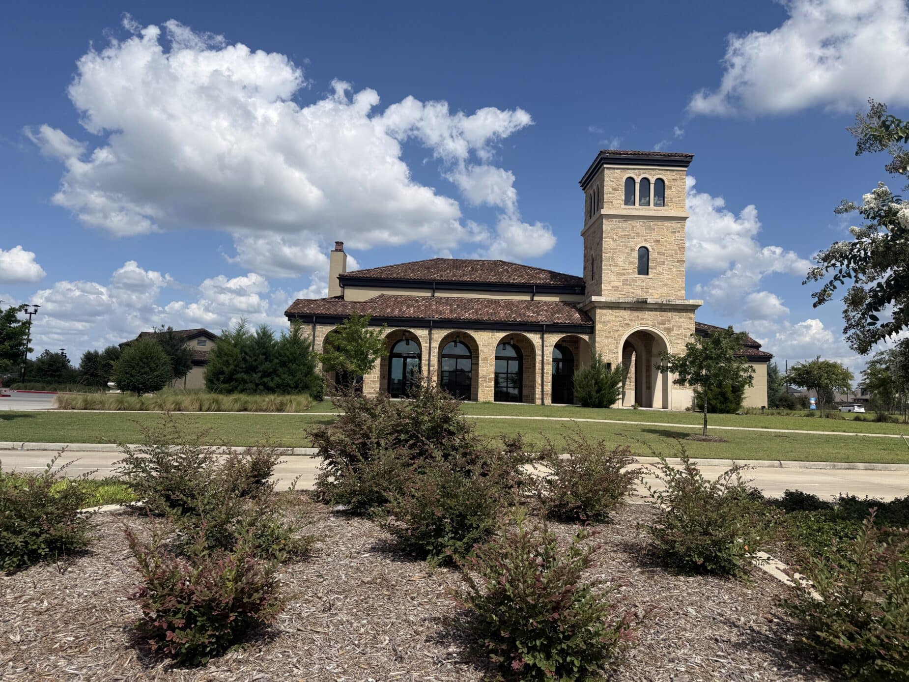 The Dunham Pointe amenity center clubhouse and stone tower — Cypress, TX 77433