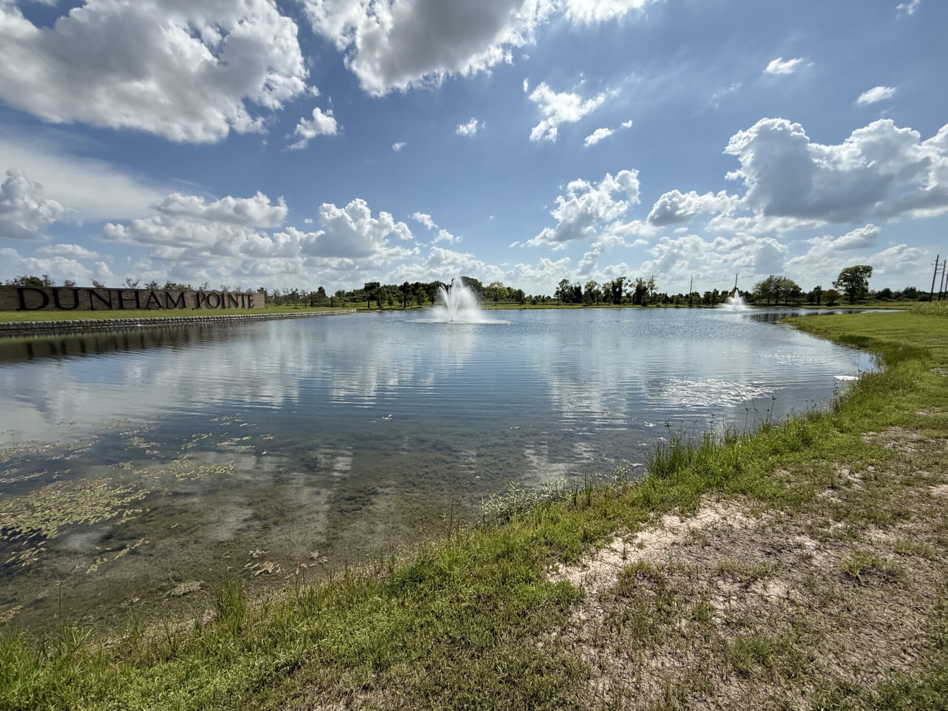 Fountains on a Dunham Pointe amenity lake beside the community entrance — Cypress, TX 77433