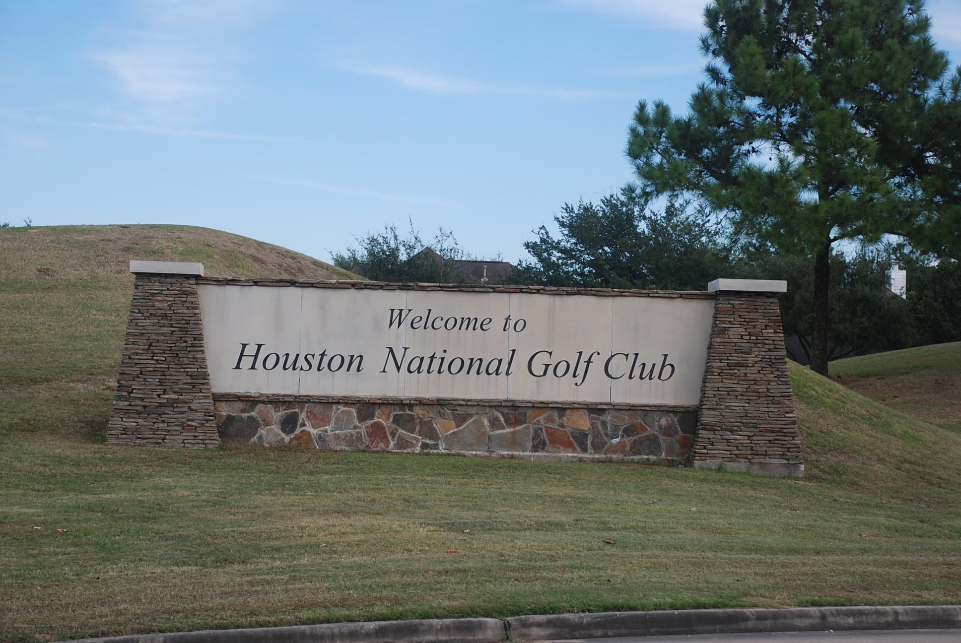 Houston National Golf Club welcome sign on Houston National Boulevard in Stone Gate