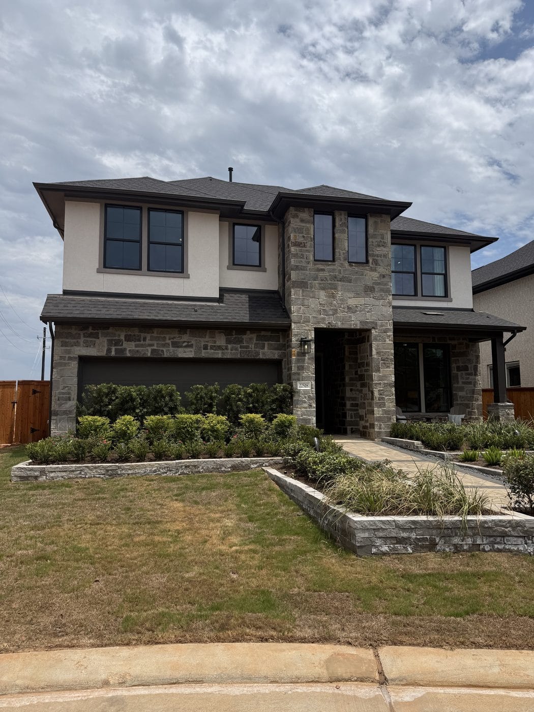 New construction model home exterior at Oakhill Reserve in Tomball