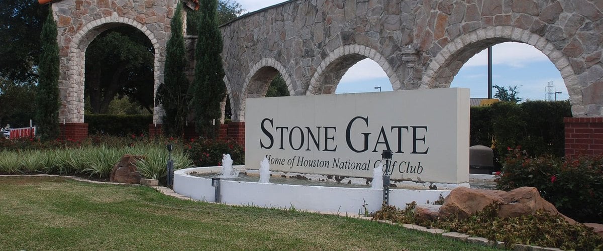 Stone Gate entrance monument with stone arches and fountain, Home of Houston National Golf Club, Houston TX 77095
