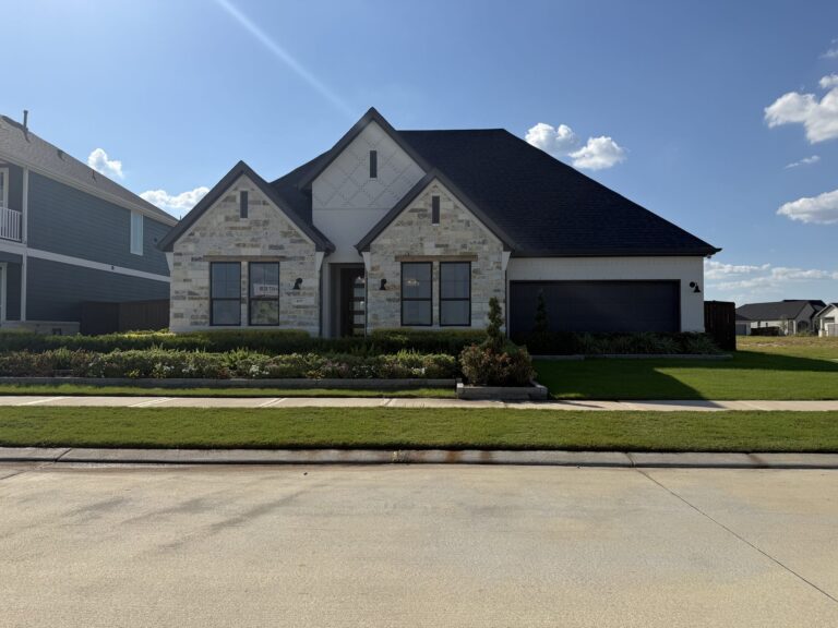 Single-story brick-and-stone model home with a front-entry garage in Attwater, Waller TX 77484