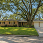 Established single-story brick ranch home on a tree-lined Houston, Texas street, typical of homes for sale in Houston $450K to $500K