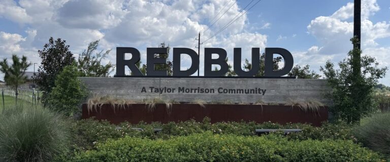 REDBUD entry monument reading A Taylor Morrison Community, Hockley TX 77447