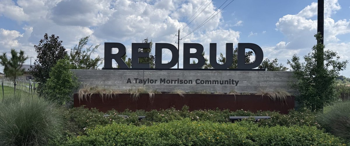 REDBUD entry monument reading A Taylor Morrison Community, Hockley TX 77447