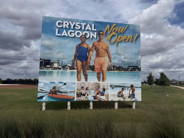 Crystal Lagoon Now Open sign at Sunterra, Katy TX 77493