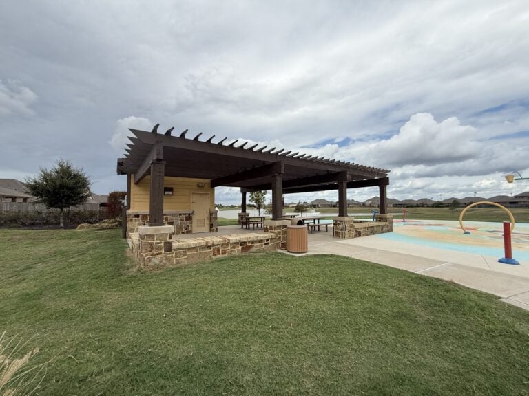 Splash pad with a shaded pergola at the North Park in Ventana Lakes, Katy TX 77493